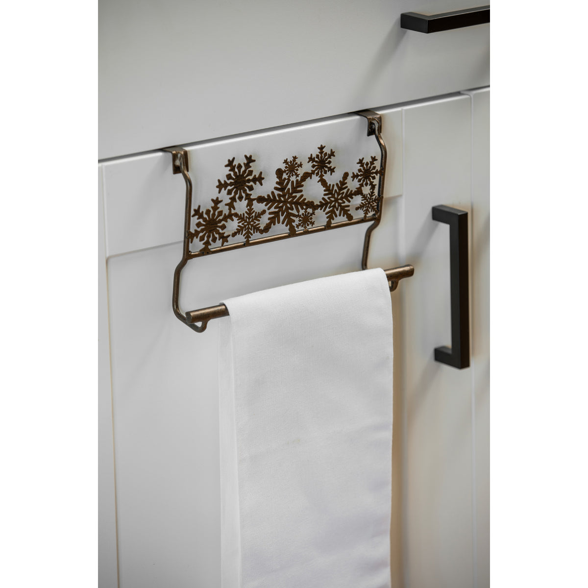 Metal Snowflakes Over the Cabinet Towel Holder